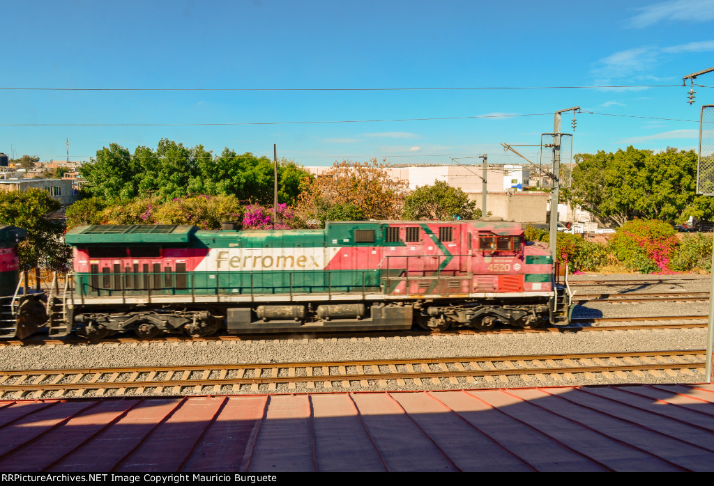 FXE AC4400 Locomotives leading a mixed freight train